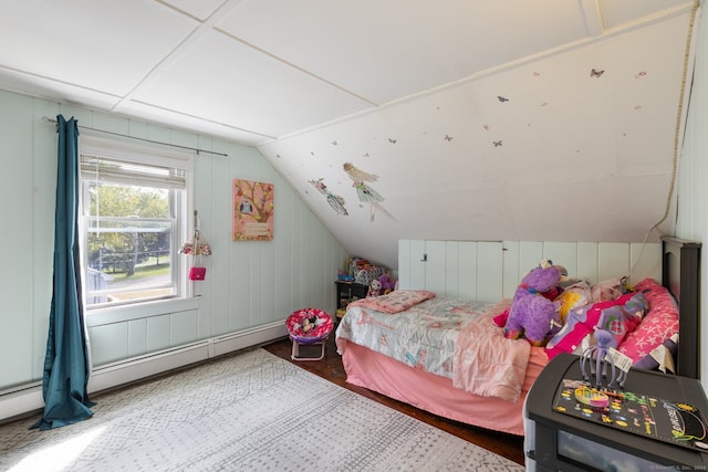 bedroom with lofted ceiling and hardwood / wood-style flooring