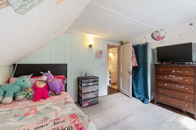 bedroom with lofted ceiling and hardwood / wood-style floors