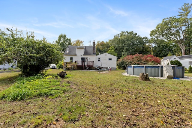 view of yard featuring a swimming pool side deck