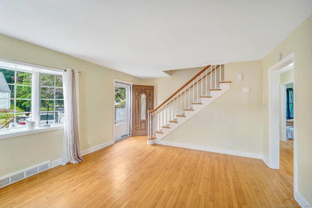 entrance foyer with light hardwood / wood-style floors