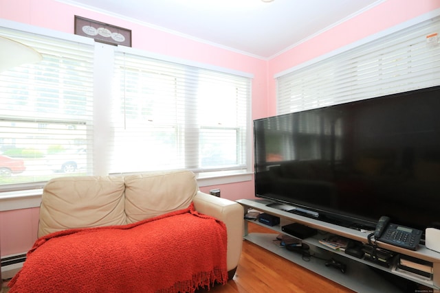 25 Muriel St, Norwalk, CT 06851 - living area with crown molding, baseboard heating, and wood finished floors
