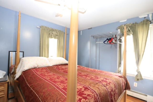 25 Muriel St, Norwalk, CT 06851 - bedroom with a baseboard radiator and wood finished floors