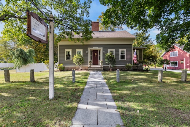 bungalow with a front yard