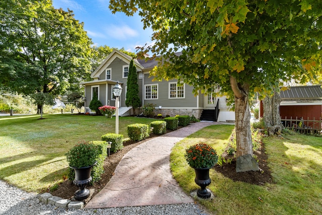 obstructed view of property with a front yard