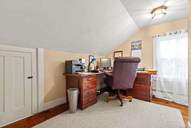 office area with wood-type flooring and vaulted ceiling