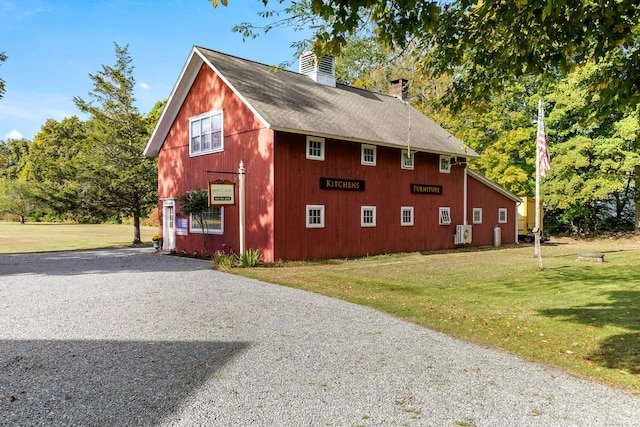 view of side of property with a yard