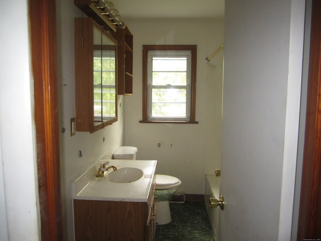 full bathroom with tub / shower combination, vanity, and toilet