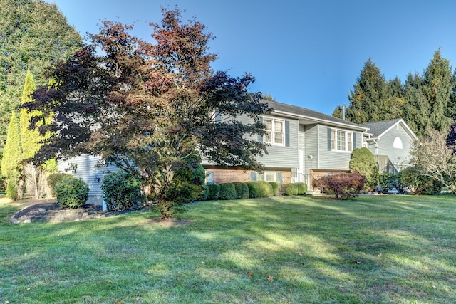 view of home's exterior with a yard