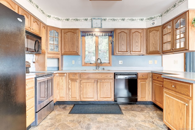 kitchen featuring sink and black appliances