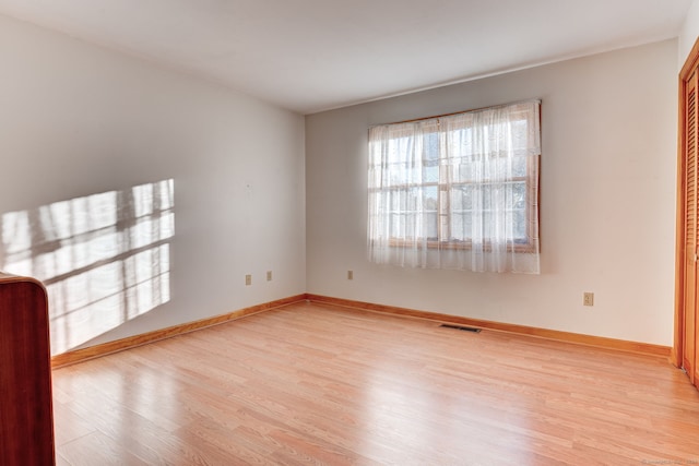 unfurnished room featuring light wood-type flooring