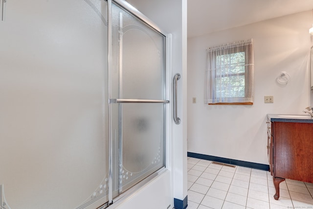 bathroom with vanity, tile patterned floors, and walk in shower