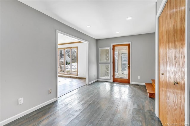 spare room with dark hardwood / wood-style floors