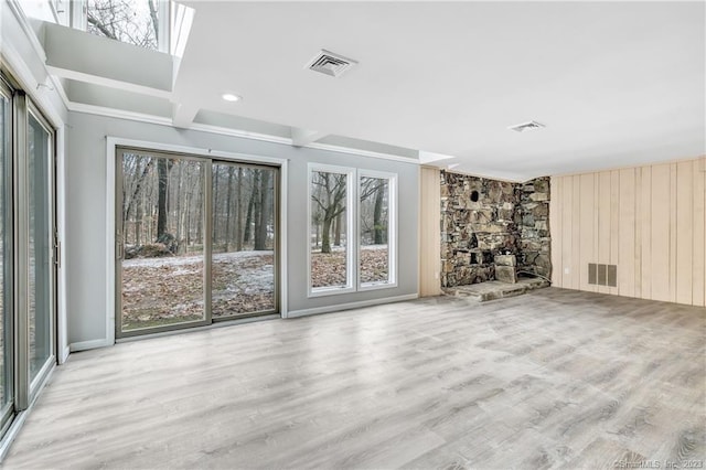 unfurnished living room featuring light hardwood / wood-style floors