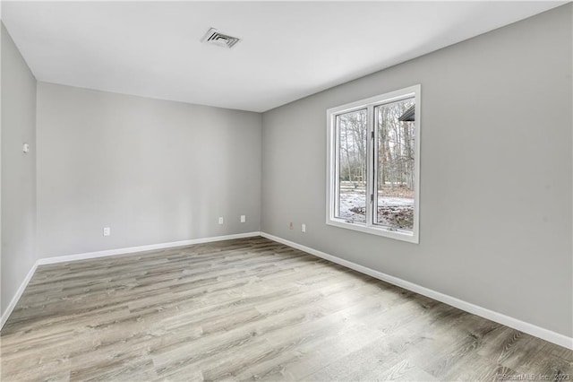 unfurnished room featuring light wood-type flooring