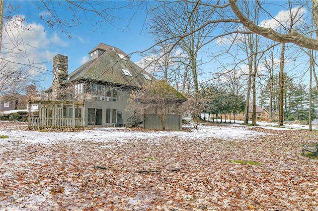 view of snow covered house