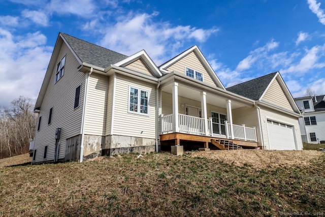 view of front facade with a porch and a garage