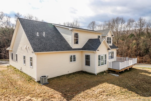 rear view of house with central air condition unit and a wooden deck