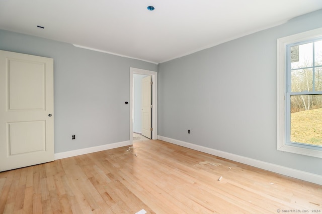 spare room featuring light hardwood / wood-style flooring