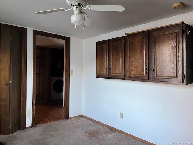 unfurnished room with washer / dryer and ceiling fan