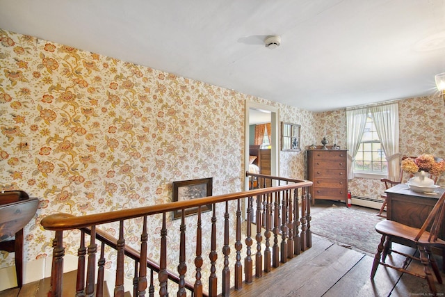 66 Artillery Rd, Middlebury, CT 06762 - corridor with wallpapered walls, hardwood / wood-style floors, a baseboard radiator, and an upstairs landing