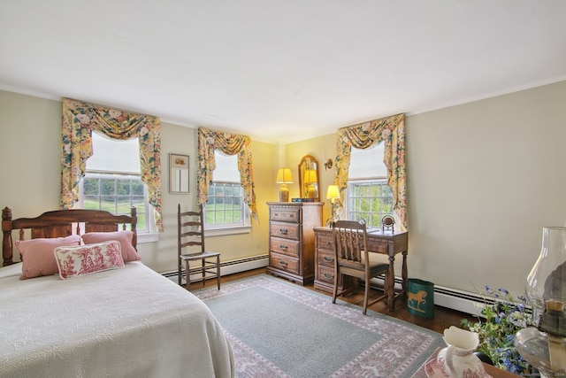 bedroom with ornamental molding, a baseboard radiator, and dark hardwood / wood-style flooring