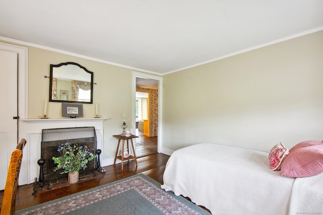 bedroom featuring dark hardwood / wood-style floors and ornamental molding