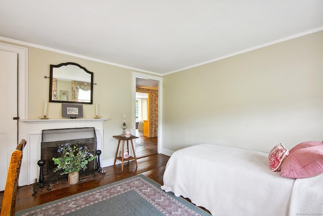 66 Artillery Rd, Middlebury, CT 06762 - bedroom with wood finished floors, baseboards, crown molding, and a fireplace with flush hearth