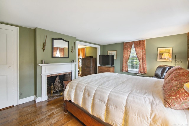 66 Artillery Rd, Middlebury, CT 06762 - bedroom featuring wood finished floors, a fireplace, and baseboards