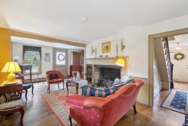 66 Artillery Rd, Middlebury, CT 06762 - living room with hardwood / wood-style floors, a fireplace, ornamental molding, and a baseboard radiator