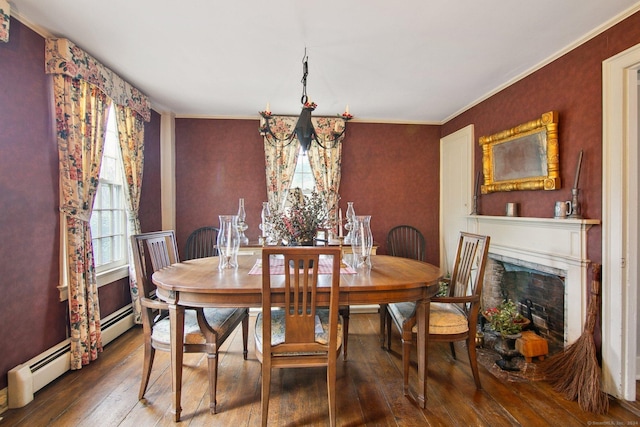 66 Artillery Rd, Middlebury, CT 06762 - dining area with wood-type flooring, a baseboard radiator, ornamental molding, and a fireplace