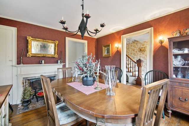 dining area featuring crown molding and hardwood / wood-style floors