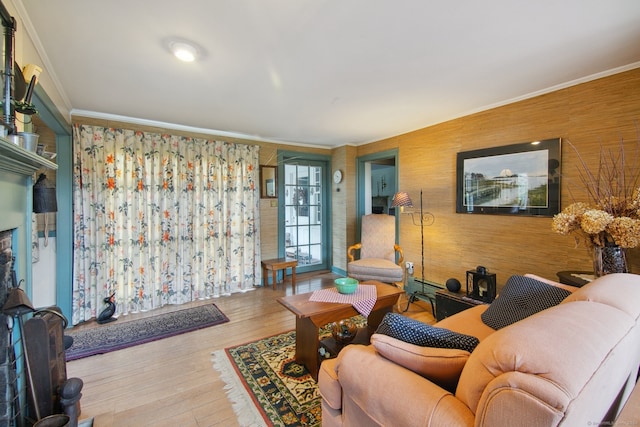 living room with crown molding and hardwood / wood-style floors