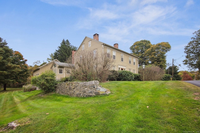 66 Artillery Rd, Middlebury, CT 06762 - view of property exterior featuring a chimney and a lawn