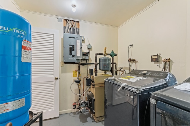 laundry area featuring ornamental molding, electric panel, and independent washer and dryer