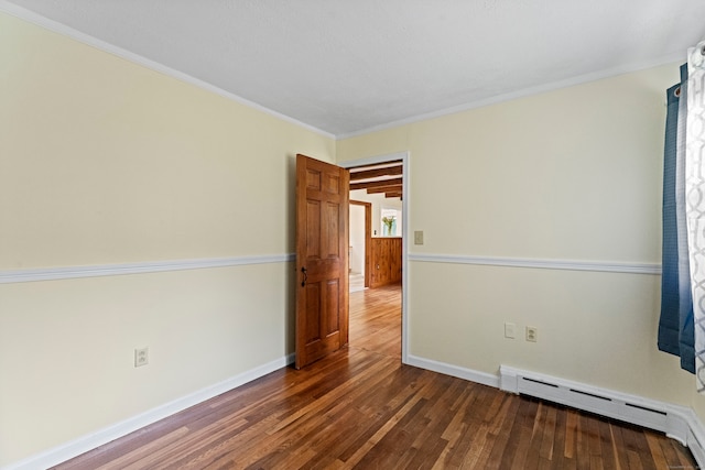 empty room with ornamental molding, baseboard heating, and dark wood-type flooring