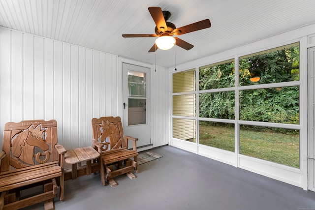 unfurnished sunroom with ceiling fan and a wealth of natural light