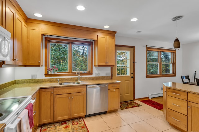 kitchen with dishwasher, sink, hanging light fixtures, baseboard heating, and light tile patterned floors