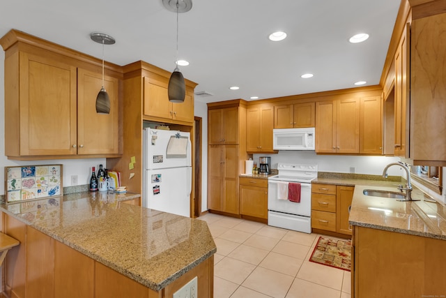 kitchen with light stone counters, white appliances, kitchen peninsula, decorative light fixtures, and sink