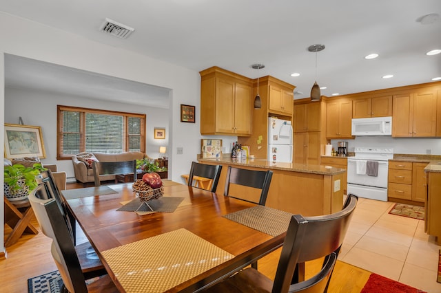 dining room featuring light hardwood / wood-style floors