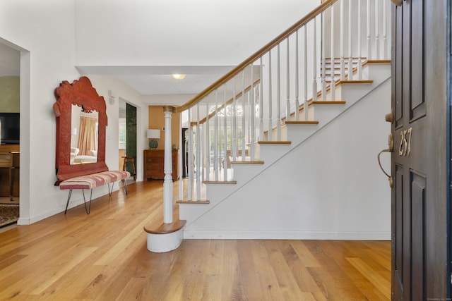 foyer entrance with light hardwood / wood-style floors