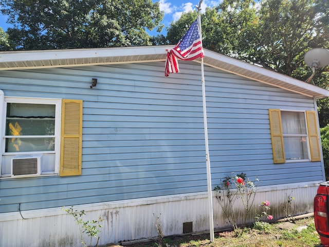 view of side of property featuring cooling unit