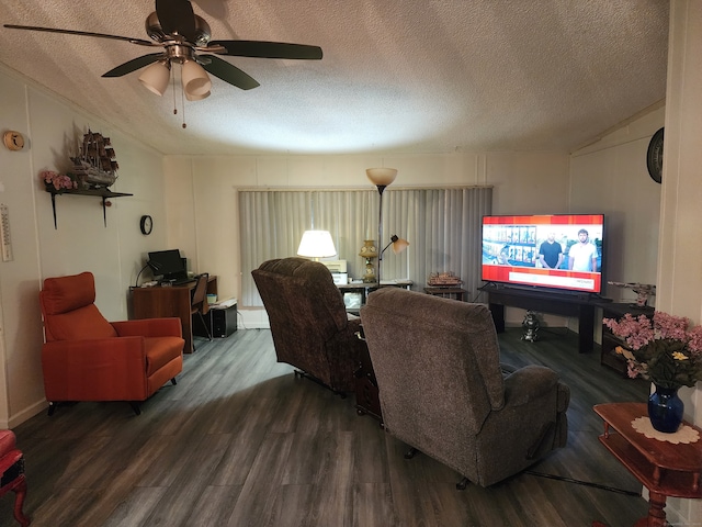 living room featuring a textured ceiling, dark hardwood / wood-style flooring, and ceiling fan