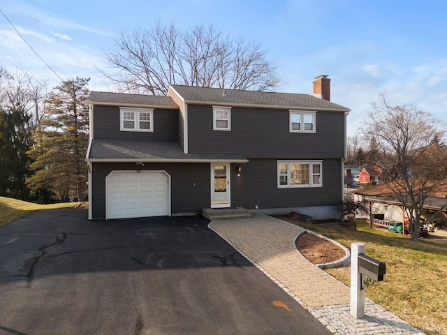 view of front of property featuring a garage