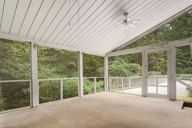 unfurnished sunroom with vaulted ceiling, ceiling fan, and wooden ceiling