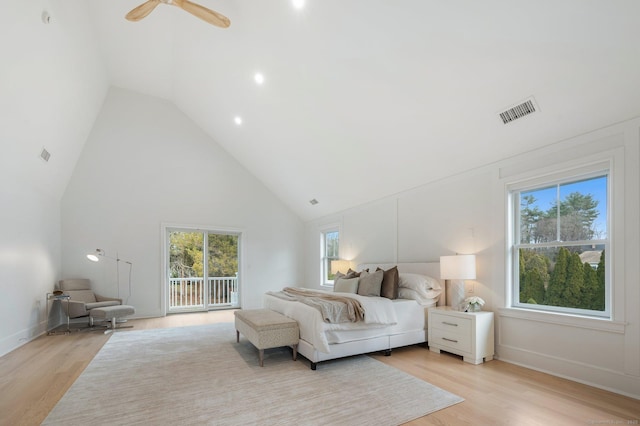 bedroom with high vaulted ceiling, ceiling fan, light hardwood / wood-style floors, and access to outside