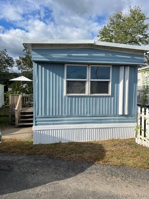 view of property exterior featuring a deck