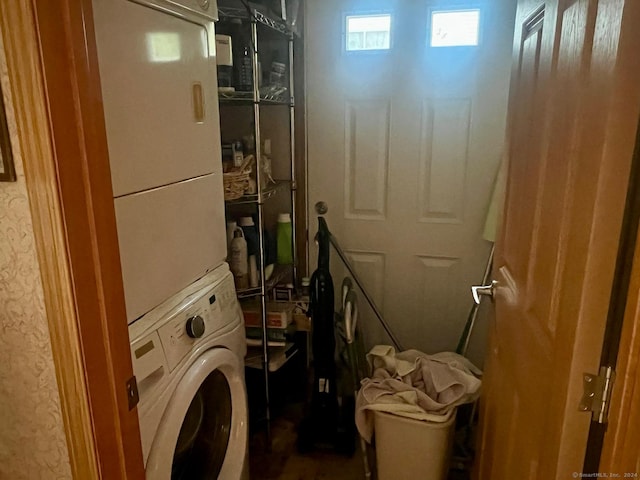 washroom with laundry area and stacked washer and dryer