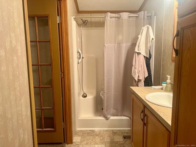 full bath with vanity and a shower with curtain