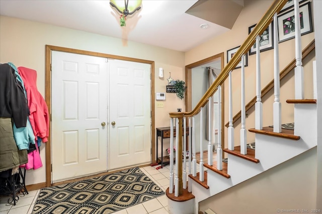 entrance foyer with light tile patterned floors