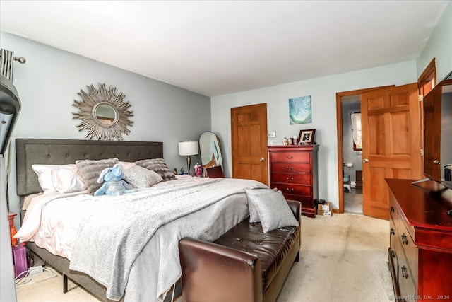 bedroom featuring light carpet